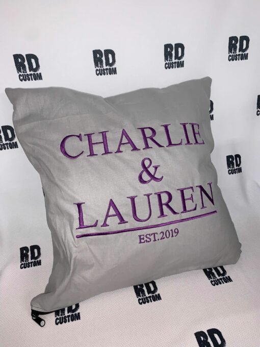 Grey couple cushion purple writing