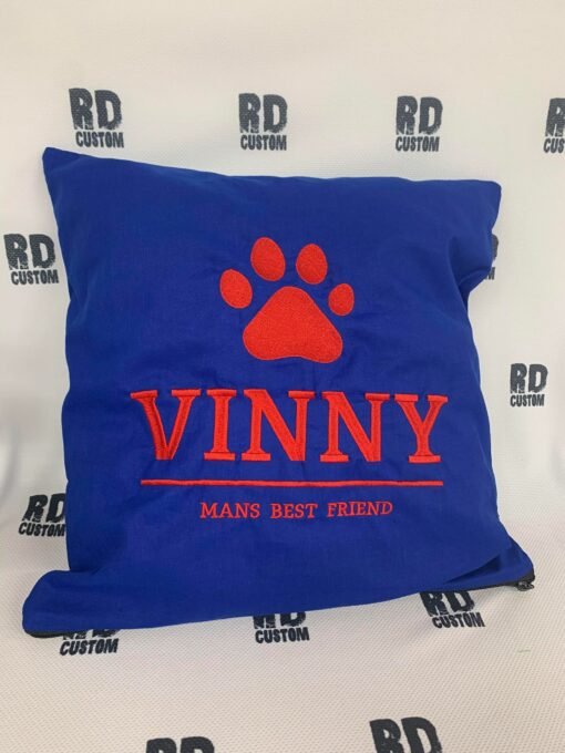 dog cushion paw mans best friend blue and red writing