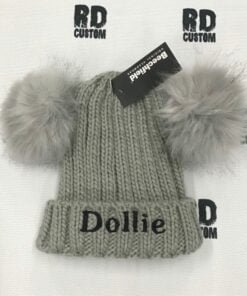 grey pom pom with black writing